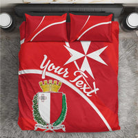 Red bedding set with Malta coat of arms, Malta cross, and white accents on duvet and pillows