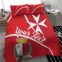 Red duvet and pillow set with Malta coat of arms, large white cross, and script text