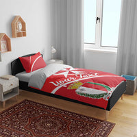 Red personalized duvet with Malta coat of arms, white Malta cross, and script text, with pillow