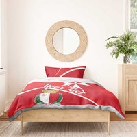Red duvet with Malta coat of arms, white Malta cross graphic, and personalized script text