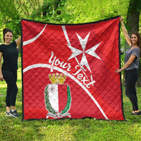 Red Malta cross quilt blanket with crest shield and white script lettering