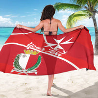 Red sarong featuring white Malta cross, arced text, and coat of arms crest