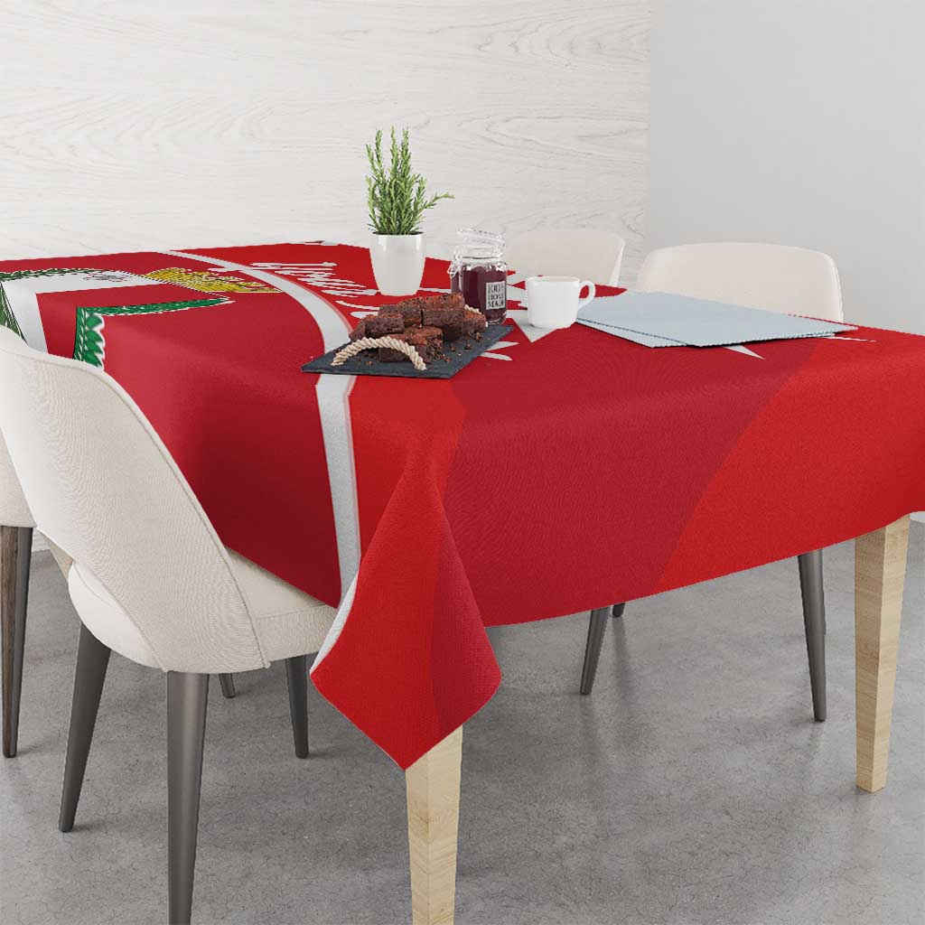 Red Malta cross tablecloth with white diagonal stripe and coat of arms near the top edge.