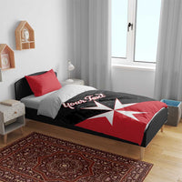 Red and black personalized duvet and pillows with white Maltese cross and 'Your Text' text