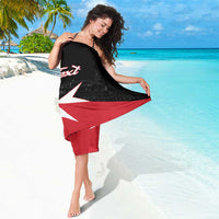 Black-red Malta cross sarong with 'Your Text' graphic, draped over shoulders