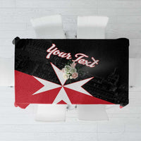 Black tablecloth with red Malta cross graphic and decorative lettering
