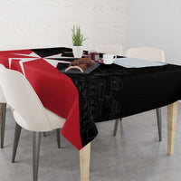 Black and red Malta cross tablecloth with red stripe across the table