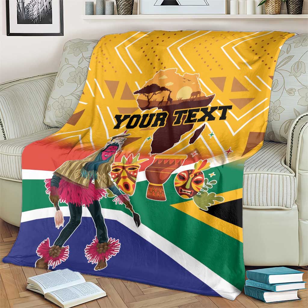 Personalized South Africa heritage blanket on cream couch, yellow chevrons and dancer graphic