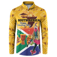 Yellow button sweatshirt with South Africa Heritage Day graphic and dancers on front.