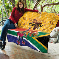 Yellow quilt spread on couch with custom text and South Africa dancer graphic