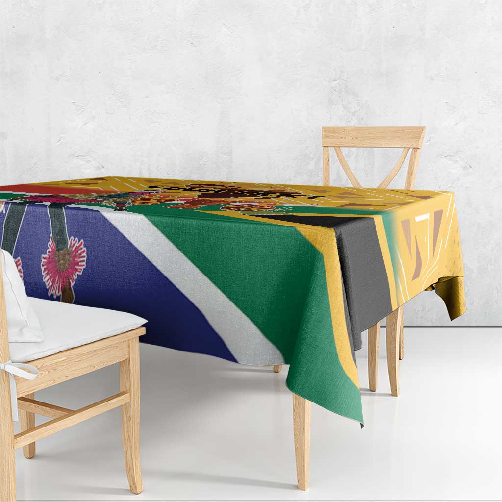 Personalized Heritage Day tablecloth draped on table, yellow with diagonal flag-color design