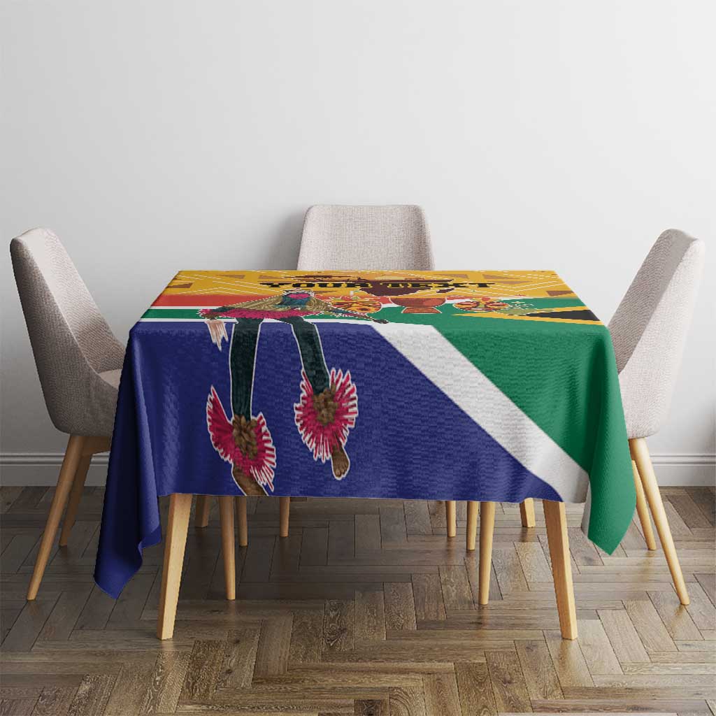 Personalized Heritage Day tablecloth on table, blue green yellow flag stripes with dancer details