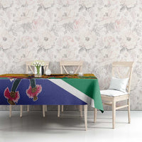Personalized Heritage Day tablecloth on dining table, yellow green blue flag motif