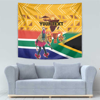Yellow South Africa heritage tapestry with dancer holding props, mask faces, and “YOUR TEXT”.