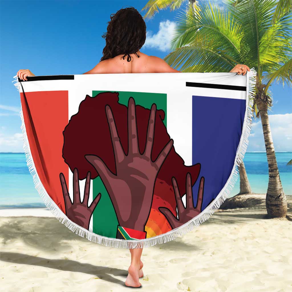 Round flag-style beach blanket with fringe, held overhead with 'YOUR TEXT' and emblem