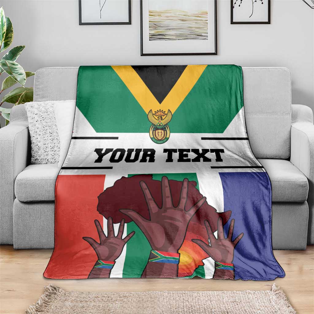 South Africa flag-style blanket draped with 'Your Text' and large hands artwork