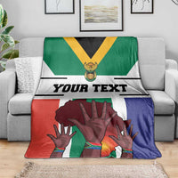 South Africa flag-style blanket draped with 'Your Text' and large hands artwork