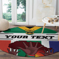 Round heritage carpet with 'YOUR TEXT' lettering and colorful flag hand design