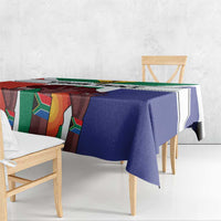 Flag-style square tablecloth draped on a dining table, blue, white, green, and red striped design