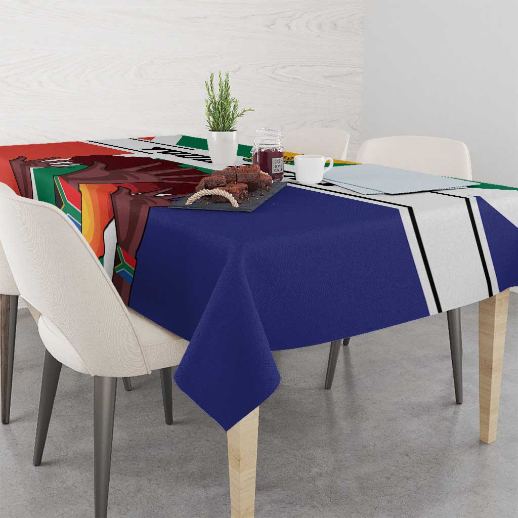 Flag-style tablecloth with bold blue border and red green accents, laid over a dining table