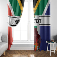 South Africa flag print window curtains draped by a doorway, green and blue with red stripes