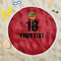 Red round beach blanket with white fringe, island crest, number 18 and custom text