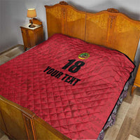 Red quilt blanket on bed, diamond stitch pattern with crest, “18,” and “YOUR TEXT”