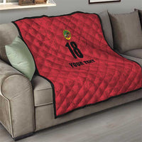 Red quilt blanket on sofa, diamond pattern with crest emblem, “18,” and “YOUR TEXT”