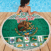 Round green beach blanket with fringed edge, Mexico coat of arms and Aztec-style icons