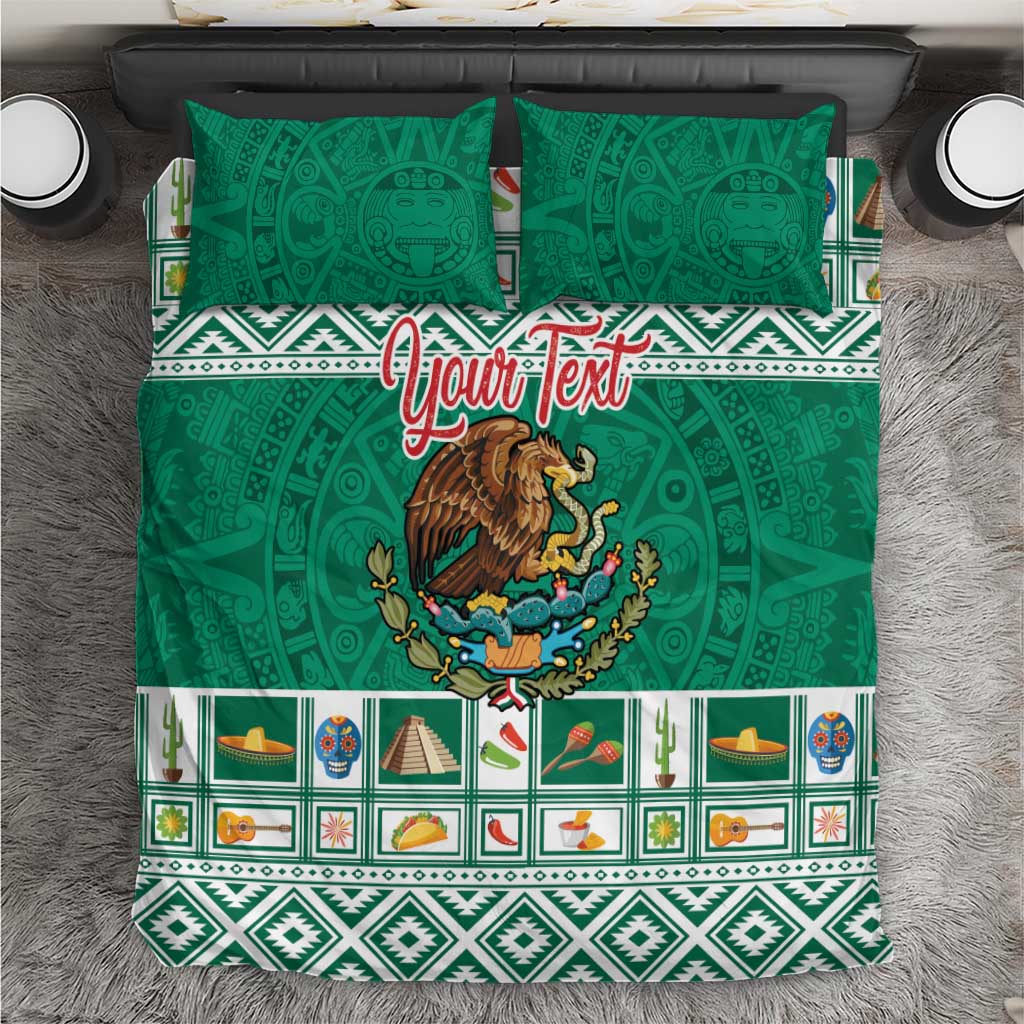 Green duvet cover and two matching pillows with eagle emblem and geometric Aztec band