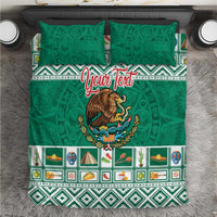 Green duvet cover and two matching pillows with eagle emblem and geometric Aztec band