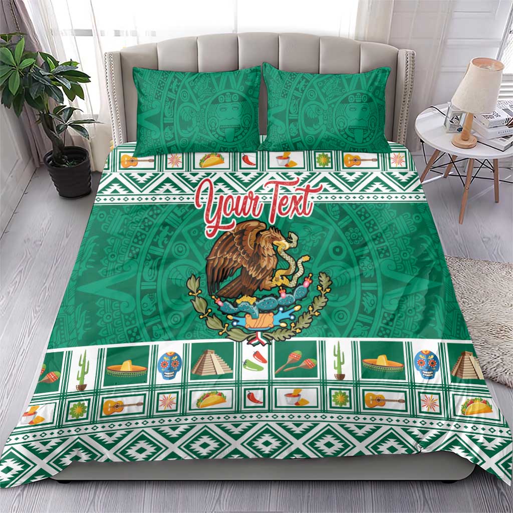 Green bedding set with eagle emblem and colorful Aztec trim, shown on a bed with pillows