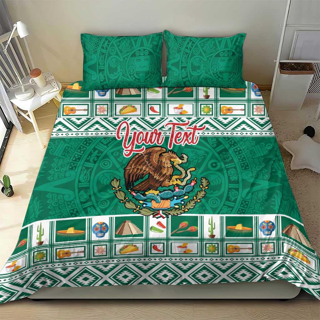 Green Aztec bedding set with eagle emblem, patterned border stripes, and two pillows
