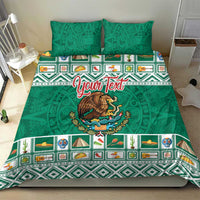 Green Aztec bedding set with eagle emblem, patterned border stripes, and two pillows