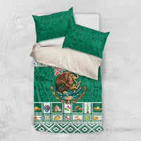Green bedding set with eagle emblem, geometric Aztec border, and two green pillowcases