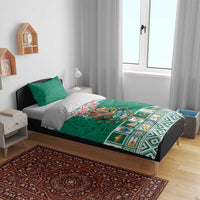 Green Aztec-style bedding set with eagle emblem and decorative border, plus two pillowcases