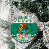 Green round ceramic Mexico ornament with eagle coat of arms and Feliz Navidad lettering.