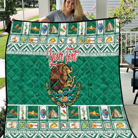 Green quilted blanket with Aztec-style border, Mexico crest, and red personalized text.