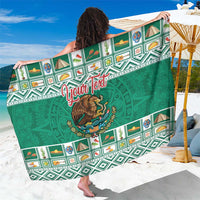 Green personalized sarong coat with Aztec border, coat of arms graphic, spread view