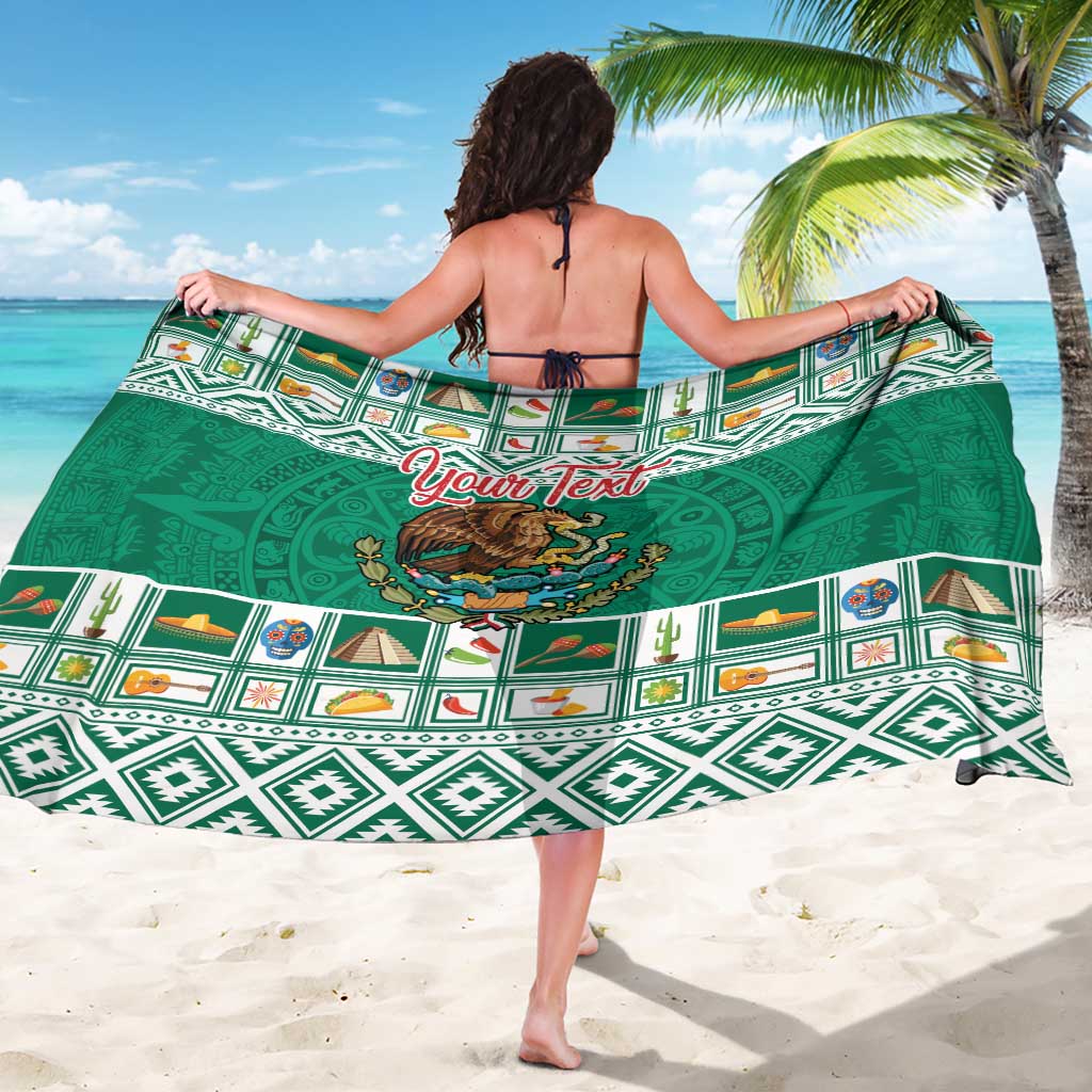 Green personalized sarong coat with Aztec patterns and large 'Your Text' emblem