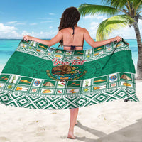 Green personalized sarong coat with Aztec patterns and large 'Your Text' emblem