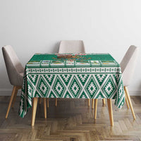 Green tablecloth with Aztec diamond pattern border for dining table