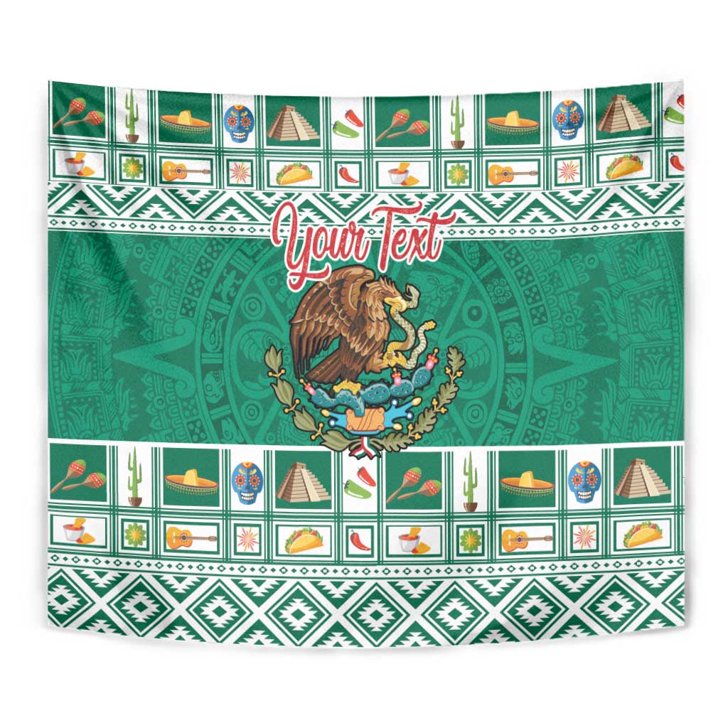 Green tapestry wall hanging showing coat of arms emblem and Aztec-style repeat pattern