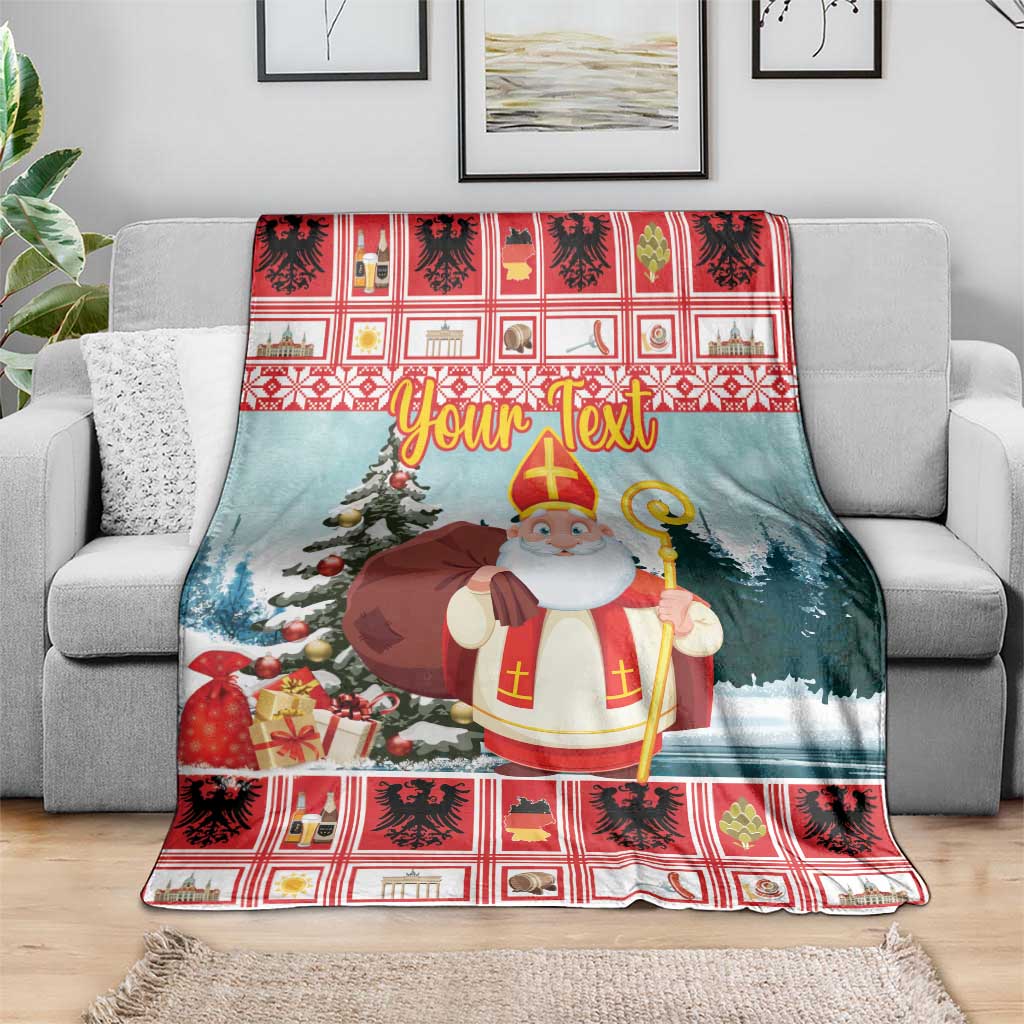 Personalized Christmas blanket draped on sofa, saint with staff, tree and gifts