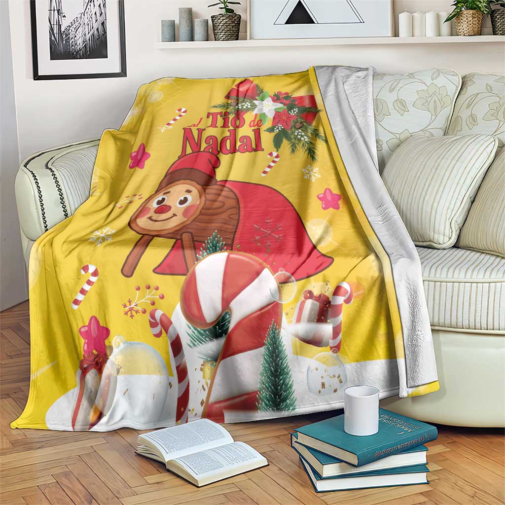 Yellow Christmas blanket with cartoon Tio de Nadal, candy canes, trees, and gift cups