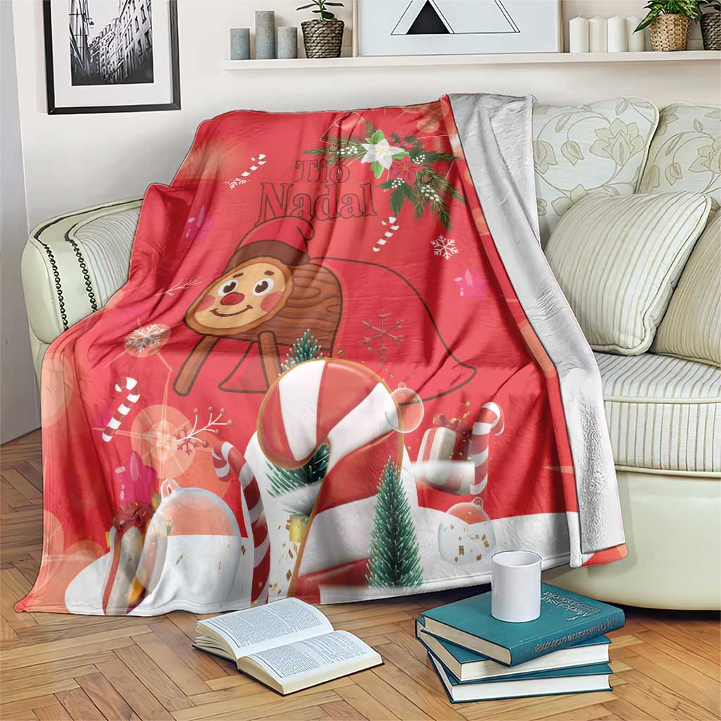 Red Christmas blanket with Tio de Nadal character, snowflakes, evergreen tree and candy mugs
