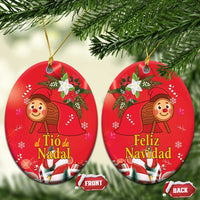 Red oval ceramic Christmas ornaments with gold hanging loops; two ornaments shown