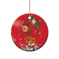 Red oval ceramic Christmas ornament with gold hanging loop and illustrated character