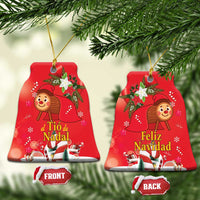 Red bell-shaped ceramic Christmas ornament with gold hanging loop; front and back labels