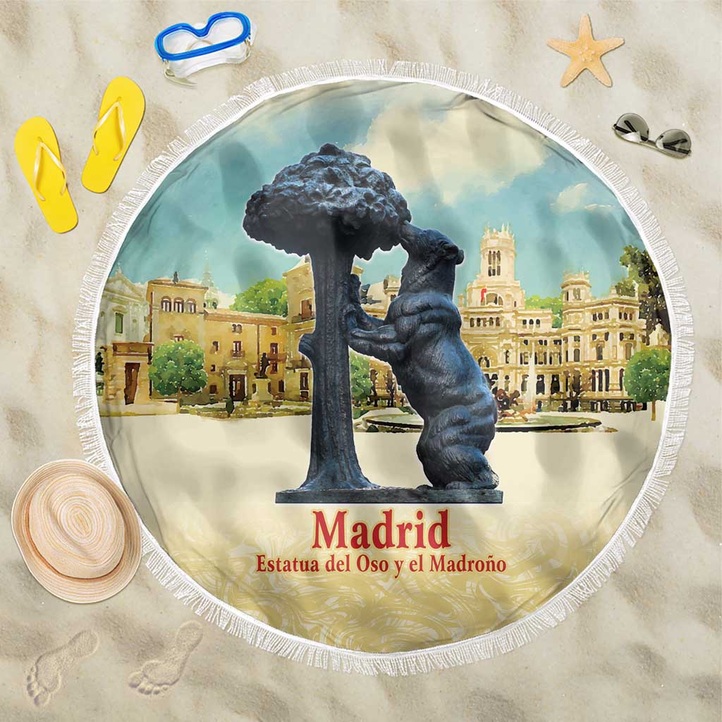 Round blue watercolor beach blanket with Madrid bear statue scene and white tassel fringe